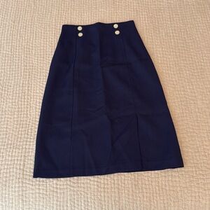 Vintage 1980s women’s sailor skirt.  Navy blue with white buttons.  Lined. 4P